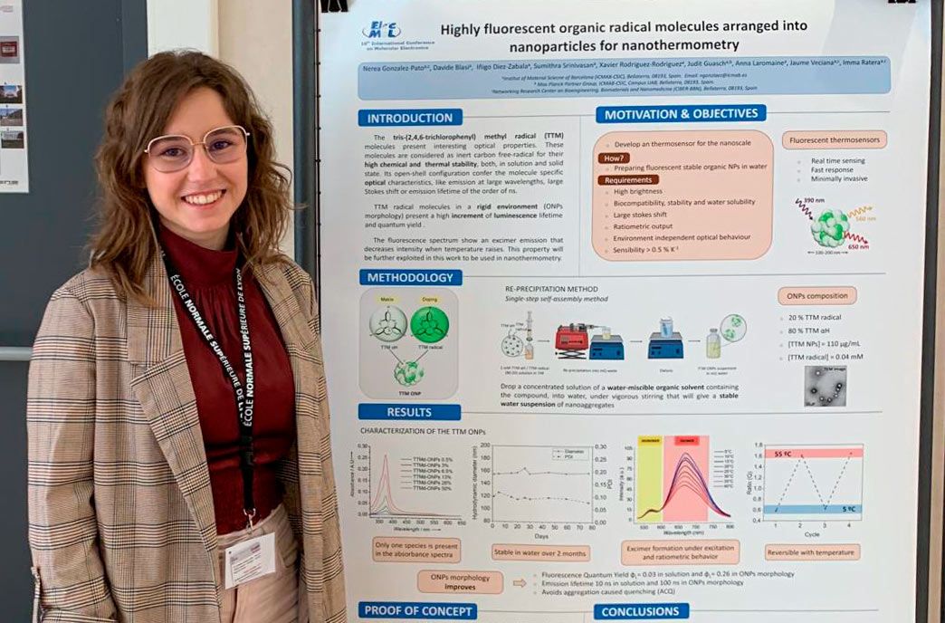 A picture of Nerea González next to her poster.