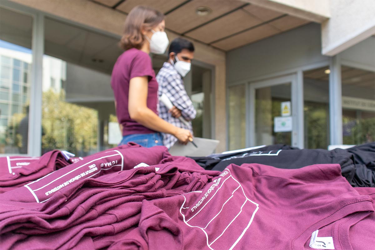 A stack of ICMAB 35 years shirts.