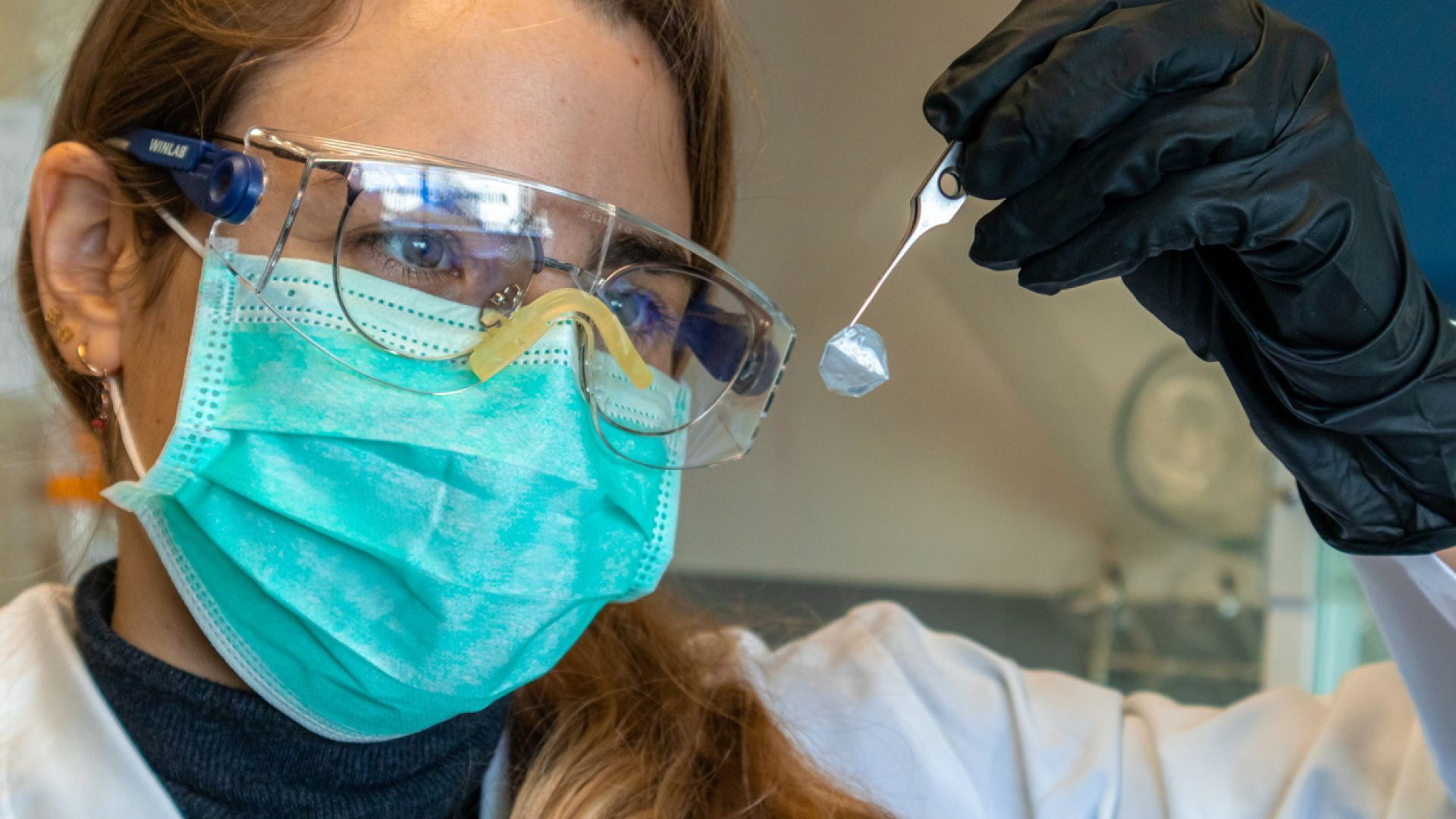 Irene Anton, researcher at the NN group, holding a bacterial nanocellulose membrane